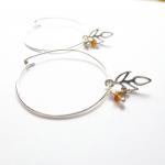 Sterling Silver Hoop Earrings With Charms And..